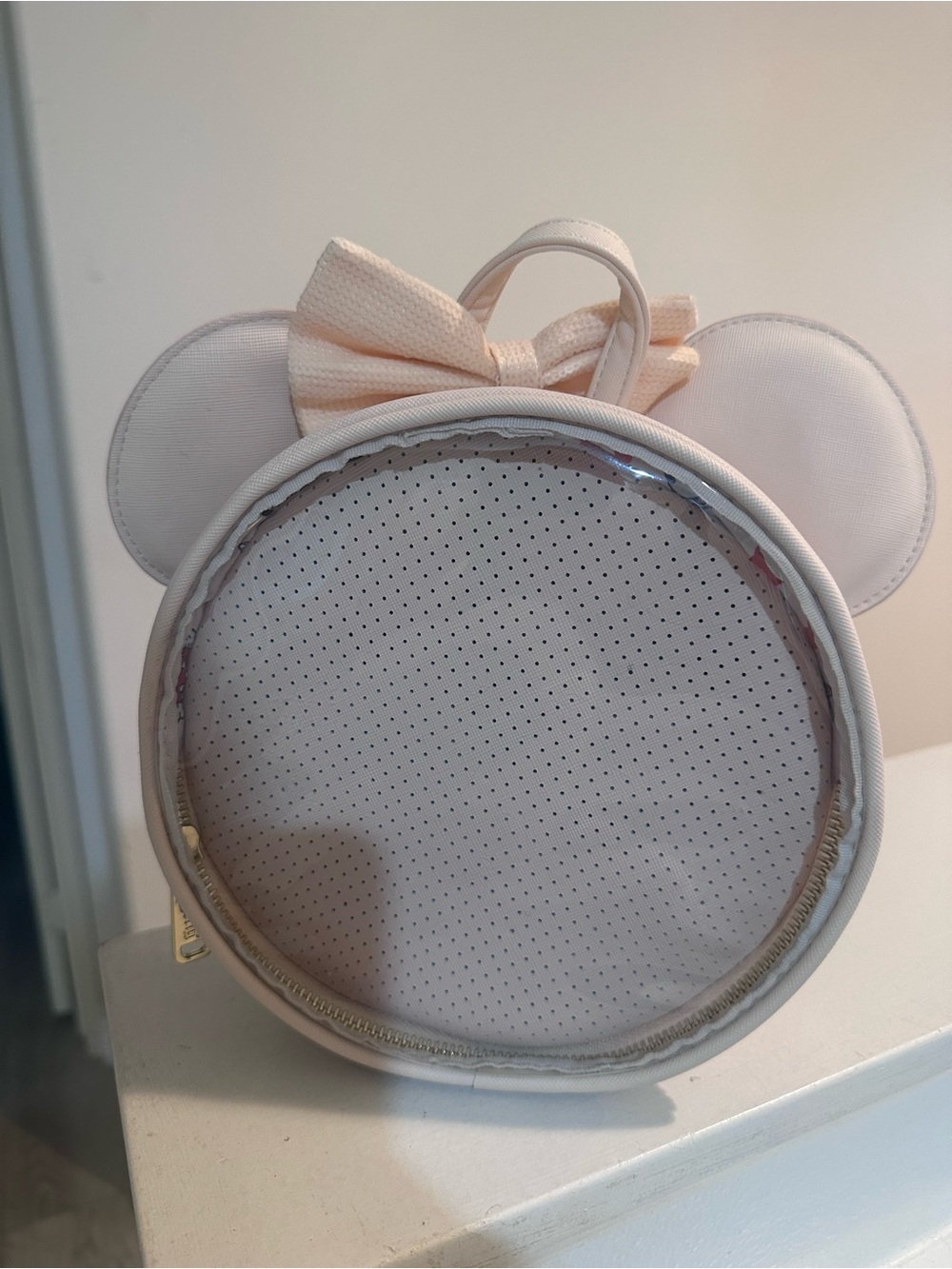 Pink Minnie loungefly backpack for displaying pins